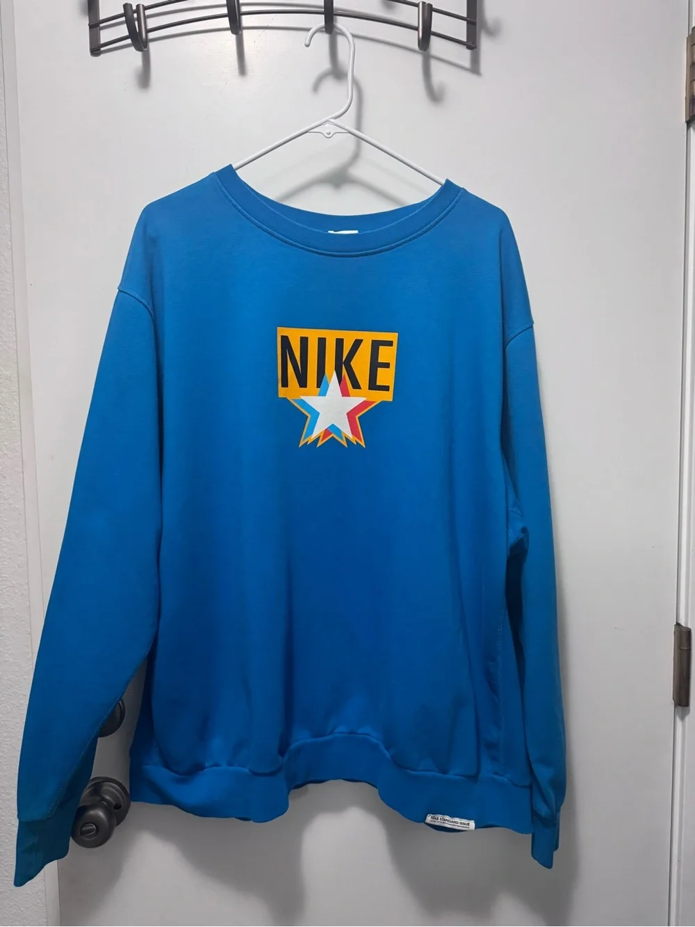 Nike Blue Crewneck Sweatshirt with Multicolor Star Logo